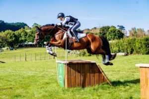 Sophie with Ben jumping cross country